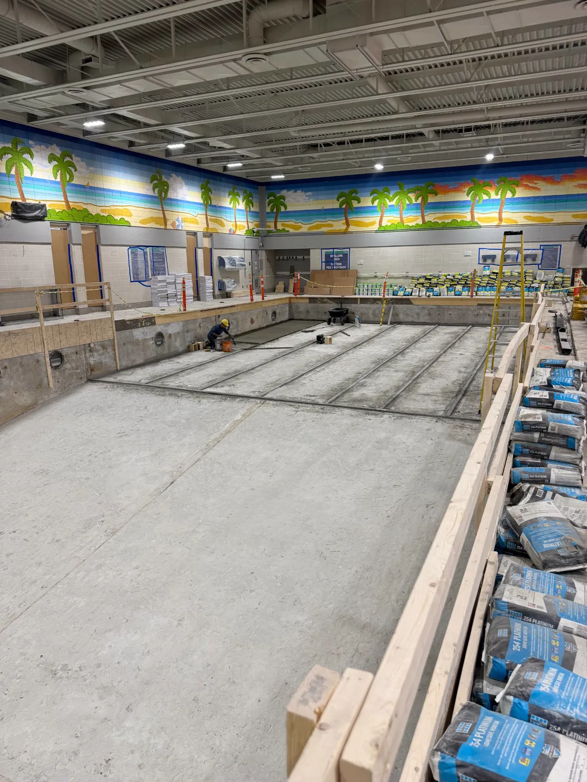 Mortar bed channels being set across the concrete