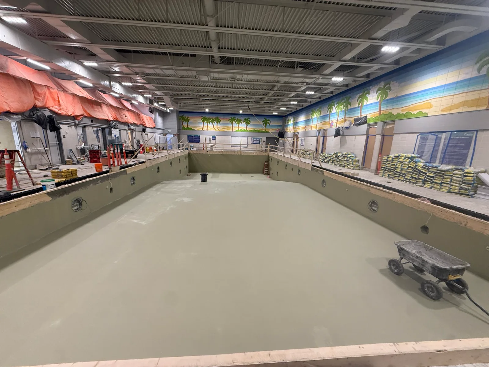 Pool basin coated in green waterproofing membrane