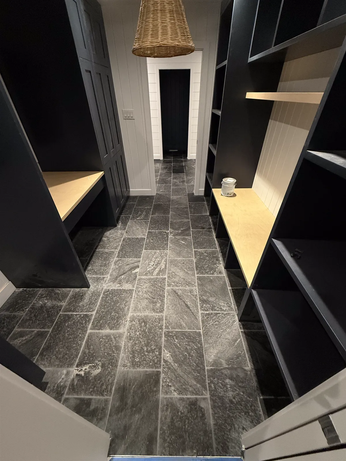 Natural slate floor through a custom mudroom