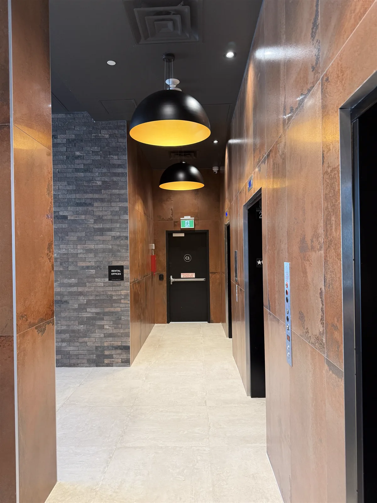 Finished corridor with copper panels and porcelain floor