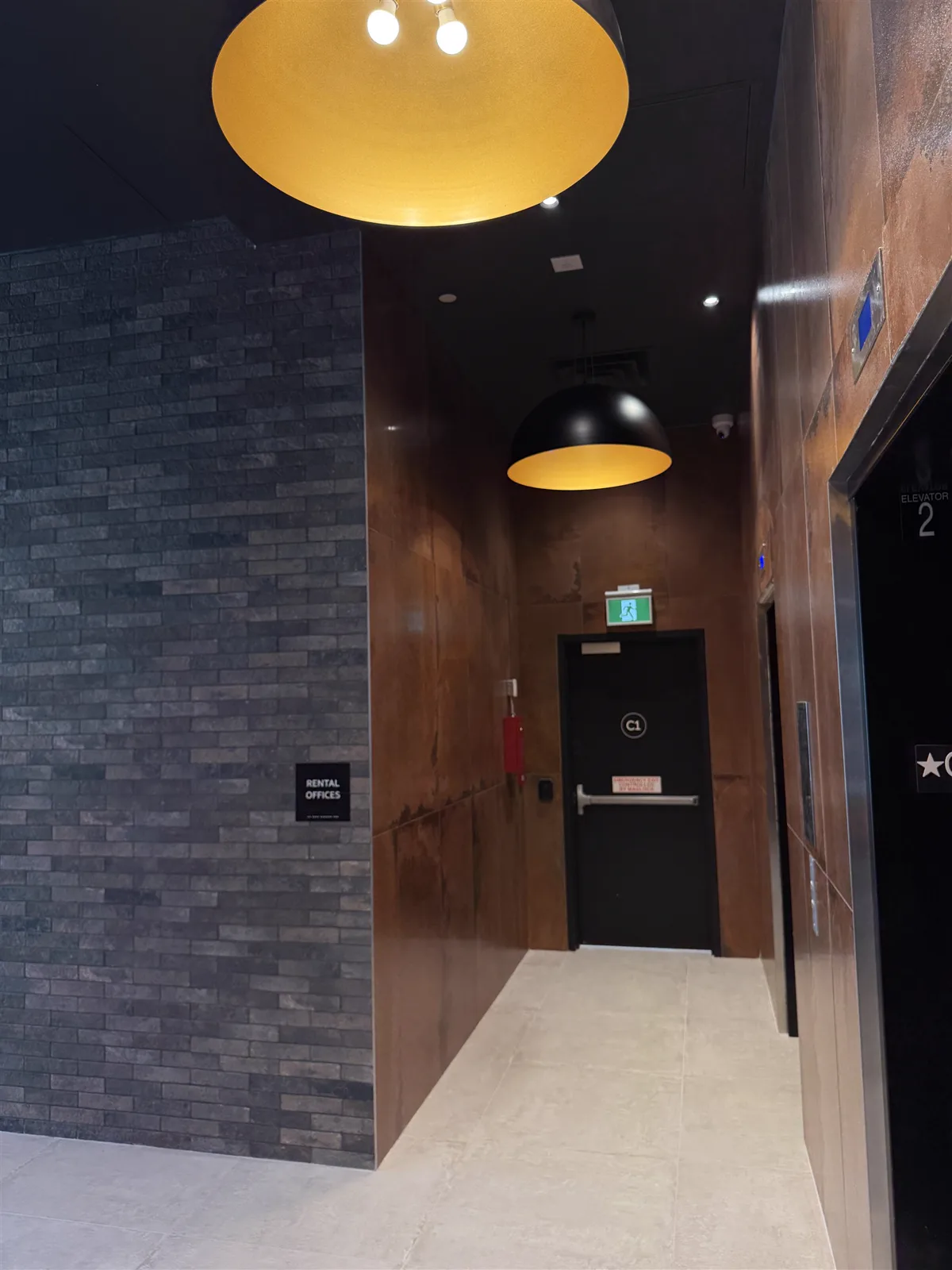 Elevator lobby with brick feature wall