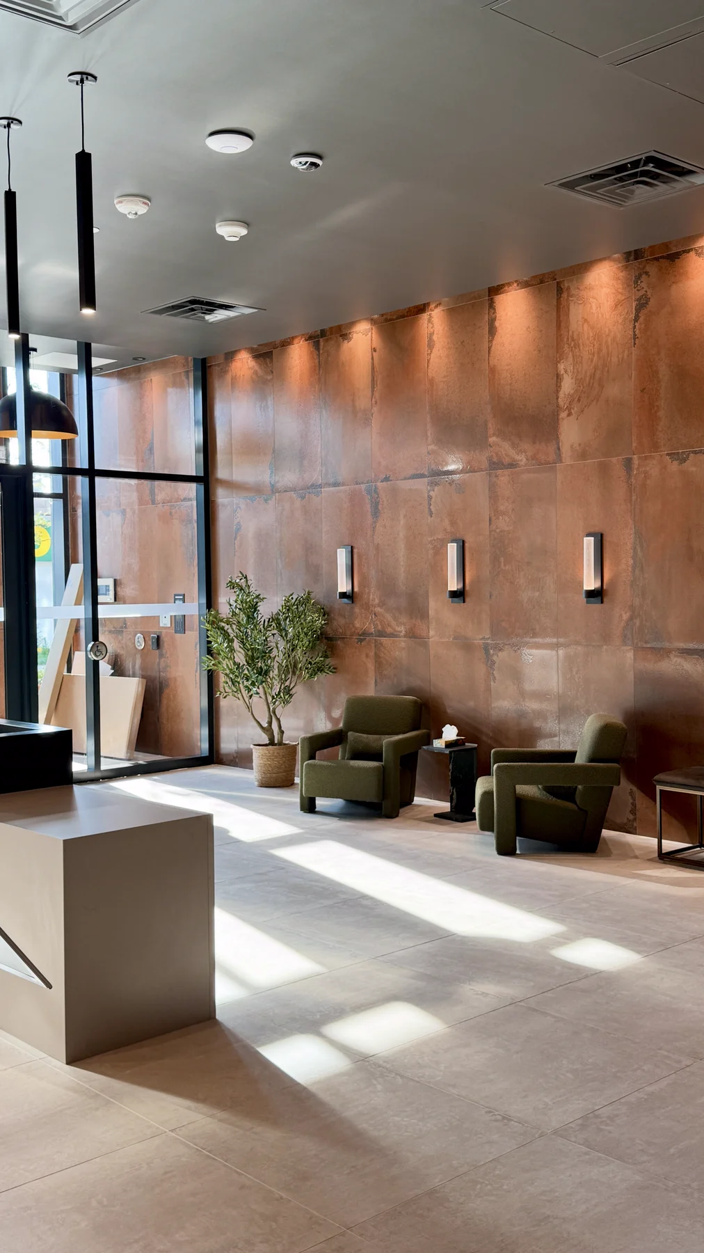 The finished lobby with copper-finish walls and porcelain floor