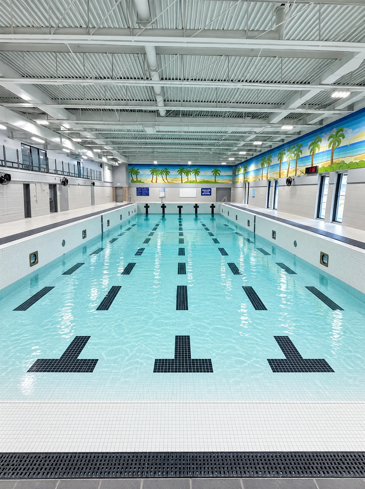 Canterbury Pool with white mosaic tile and black lane markings